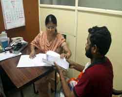 Dr. Anitha attending a patient